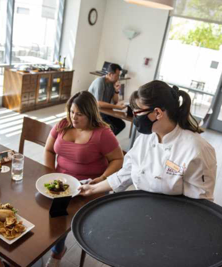 Woman is served meal