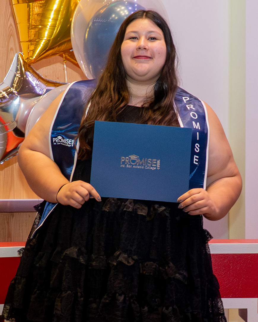 Jessica Moreno holds up an award.