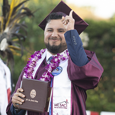 A student at Mt. SAC's graduation receives his diploma. 
