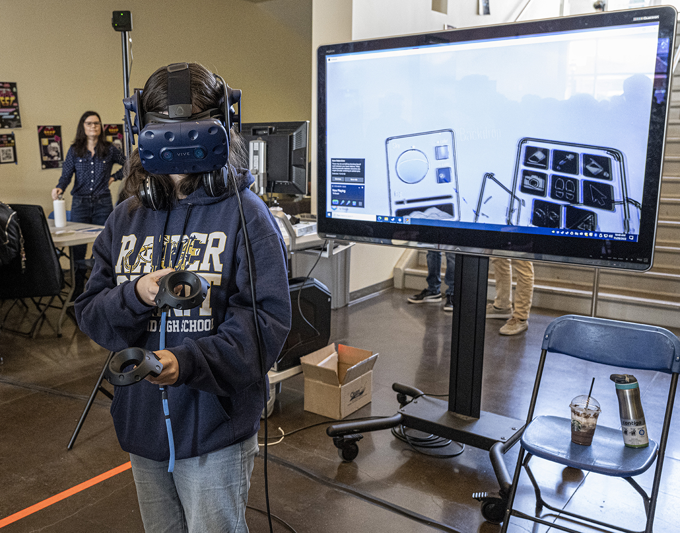 Mt. SAC student plays a VR video game.