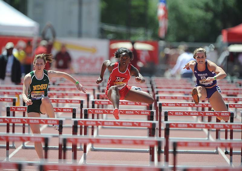 three relays competitors running the hurdles