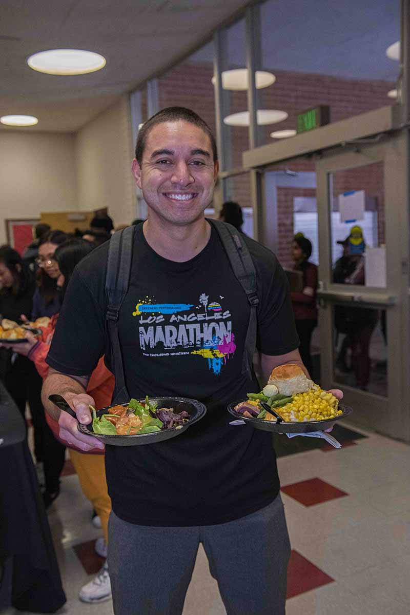 Student enjoys Thanksgiving Dinner