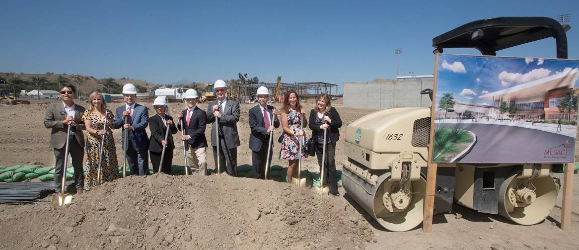 Board, COC in dirt with shovels