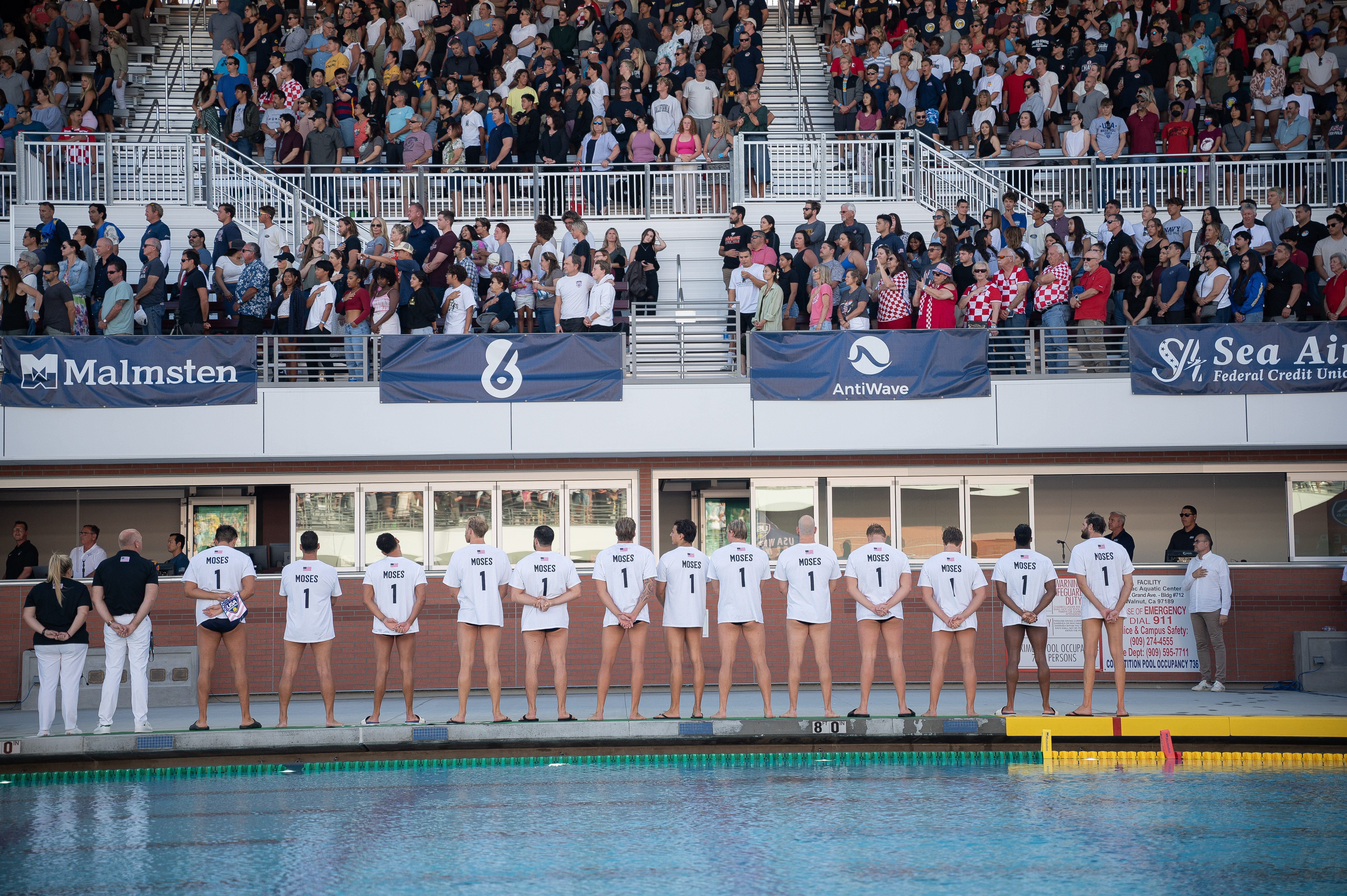 water polo players lined up along pool