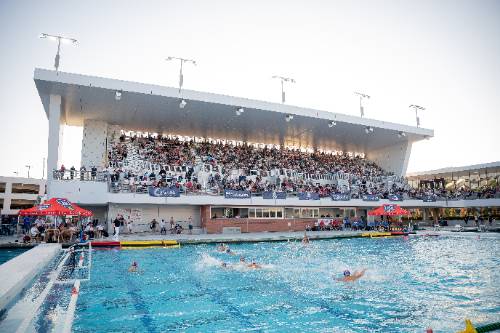 Water polo players splash in pool