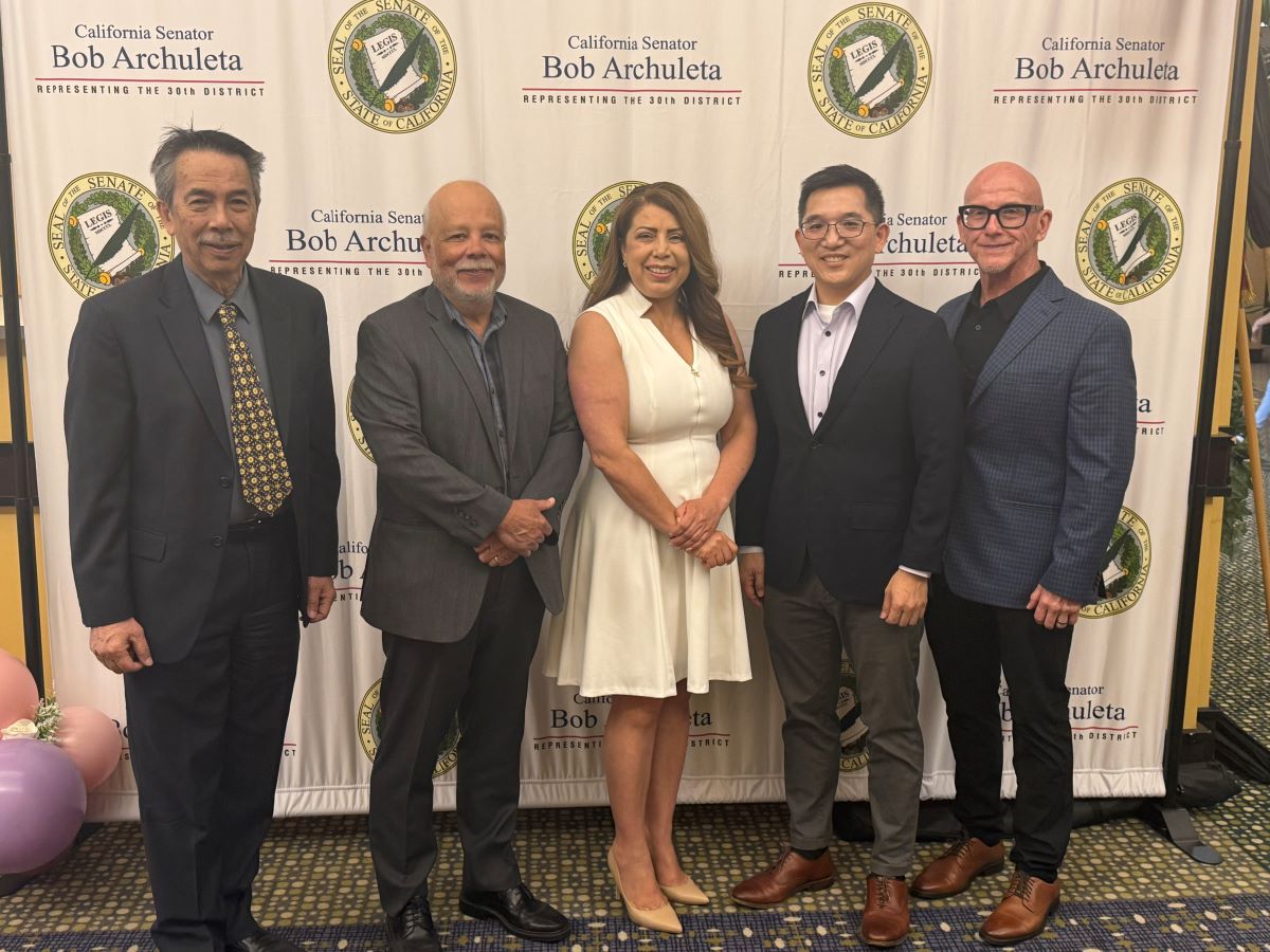 Dr. Garcia and the male members of the Board of Trustees