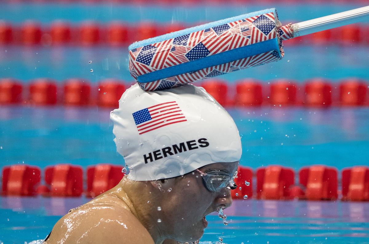 A device helps a blind swimmer know when she has reached the end