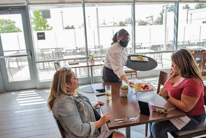 Customers being served by student