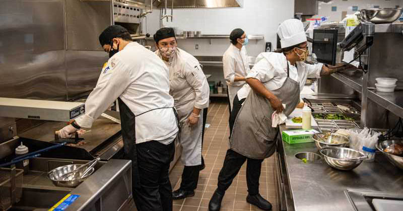 Students working the kitchen