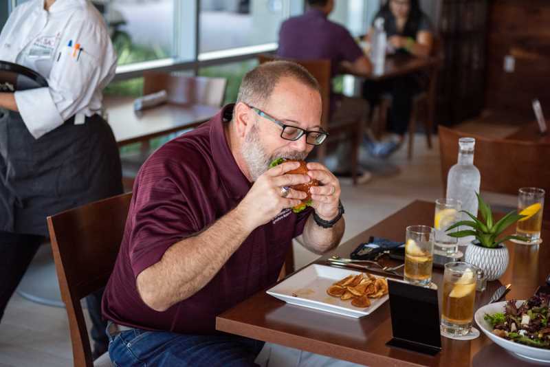 Customer bites into the burger