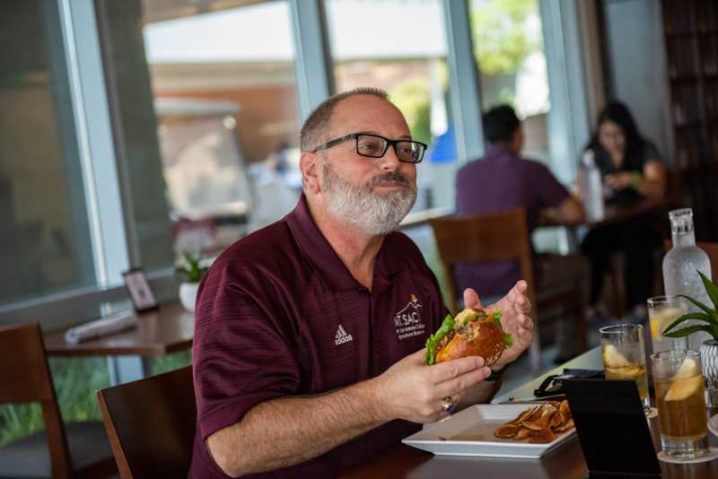 Customer bites into the burger