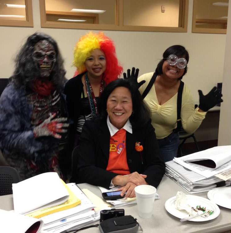 Audrey with students and staff one Halloween