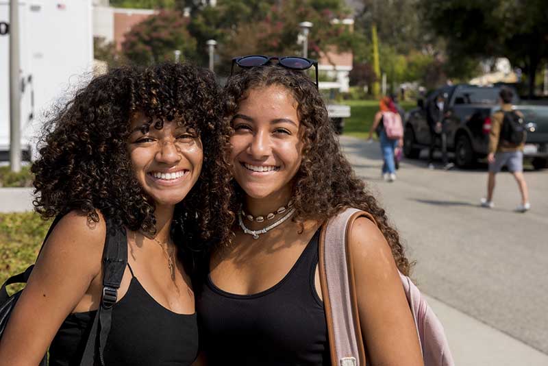 Smiling students pose for photo