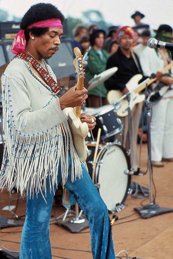 Jimi Hendrix performs at Woodstock by Henry Diltz