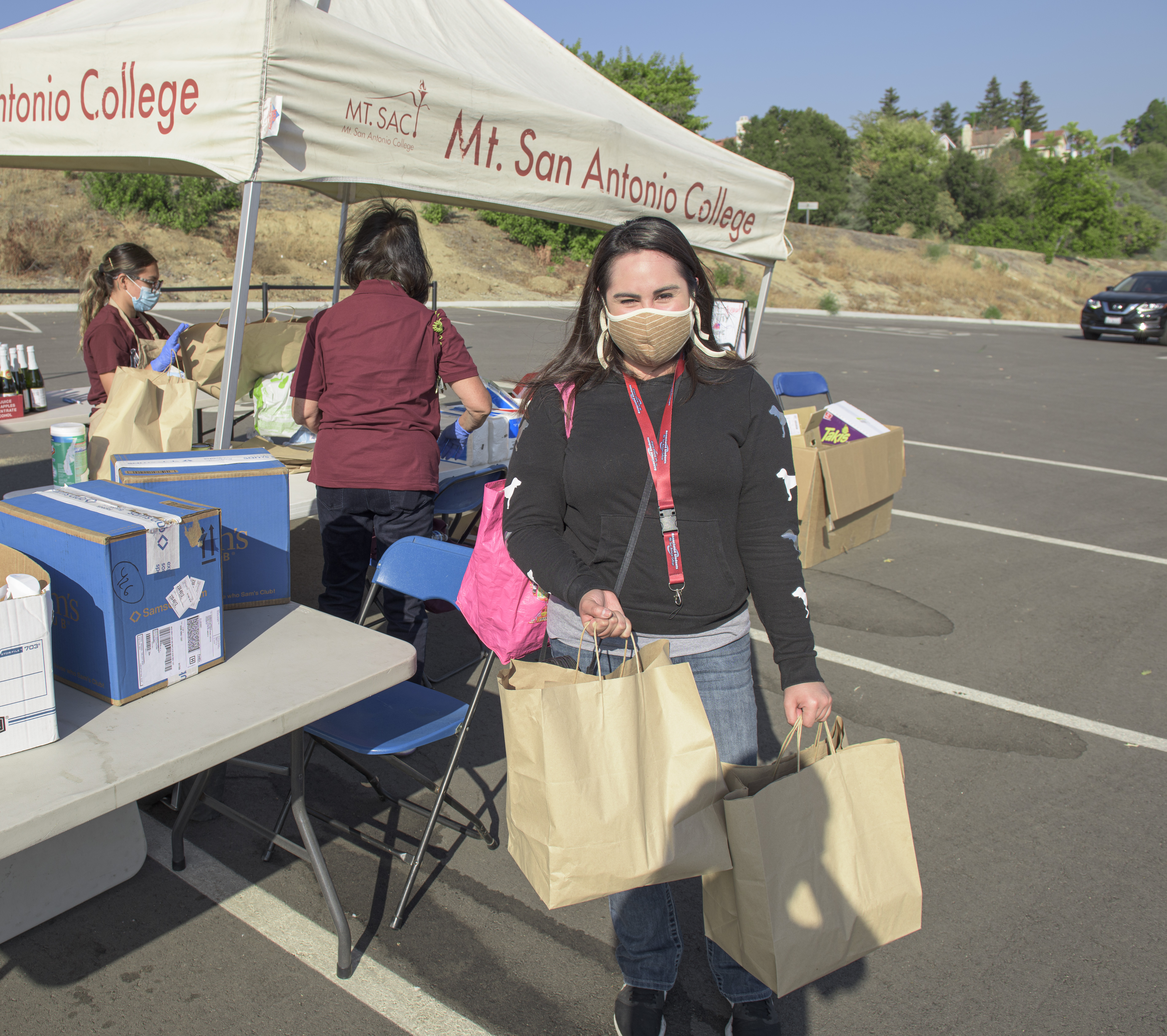 students with bags of food