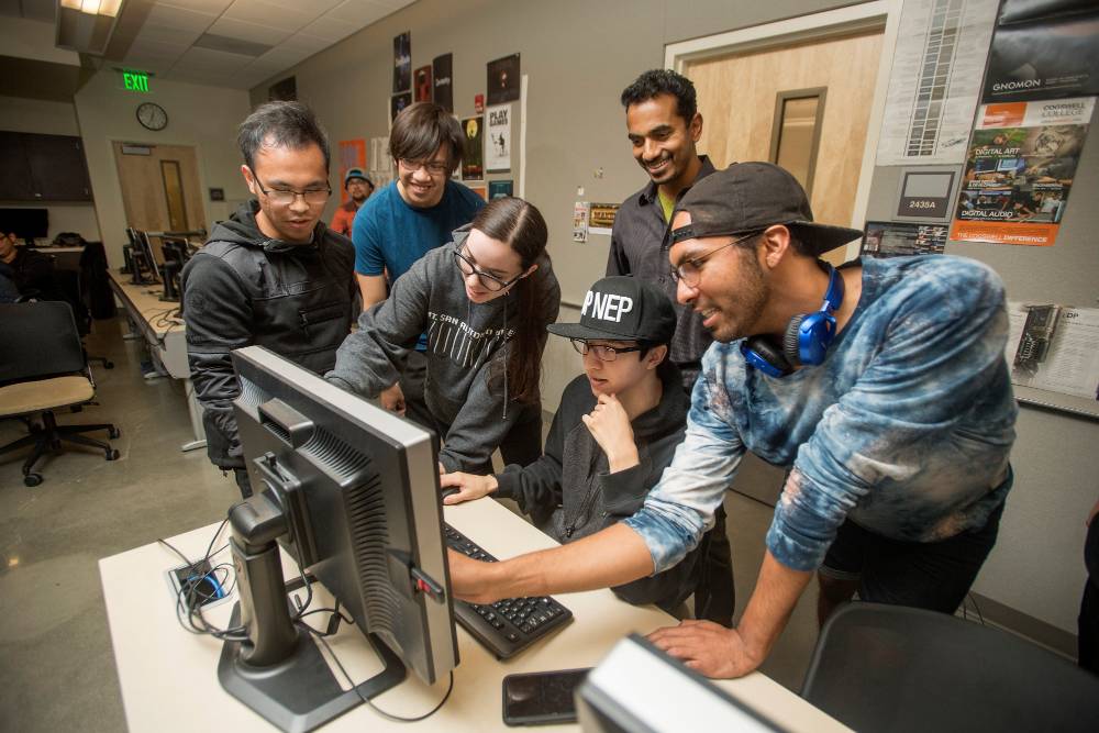 A group of students check out an animation test