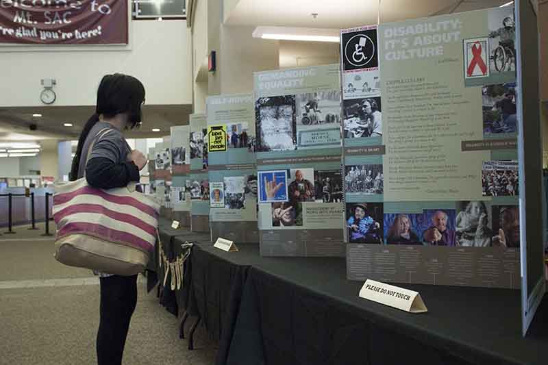 Ann looks at exhibit