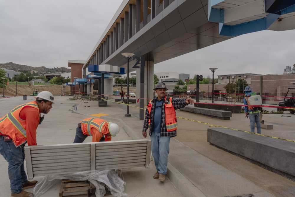 Construction workers put finishing touches on the Transit Center