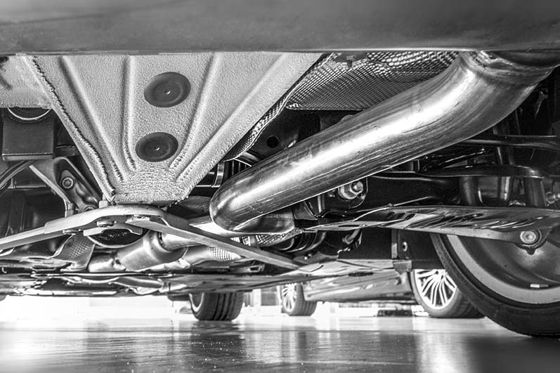 Undercarriage of car showing exhaust system