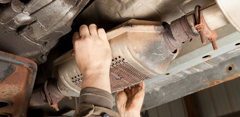 Catalytic converter being removed from car