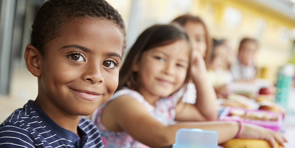 Young children eating a meal