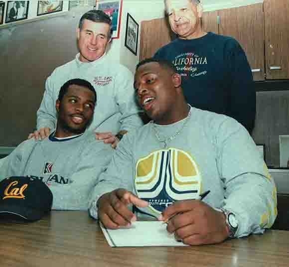 Coach Rod (top right) at a player signing