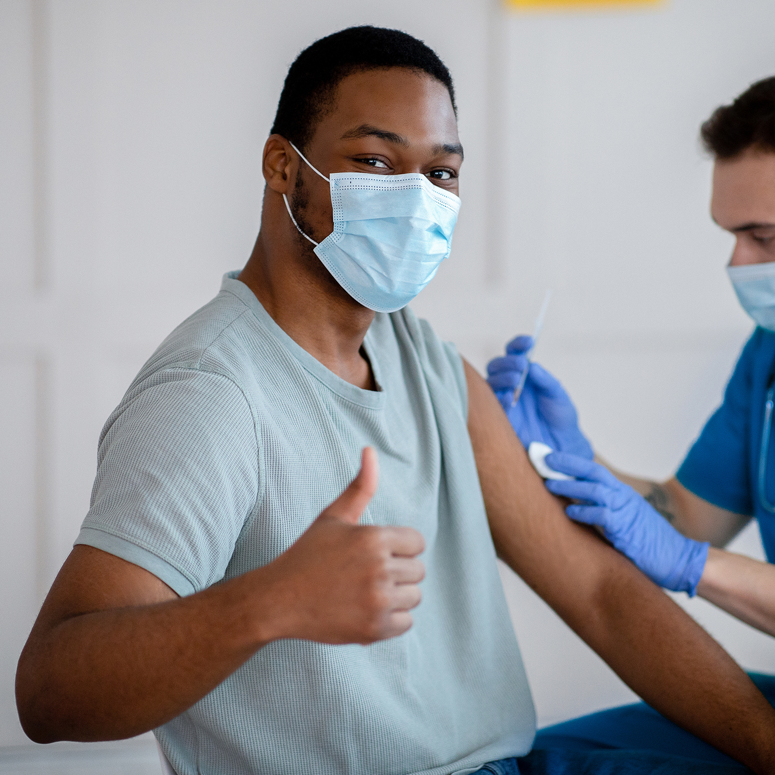 Person getting vaccination.