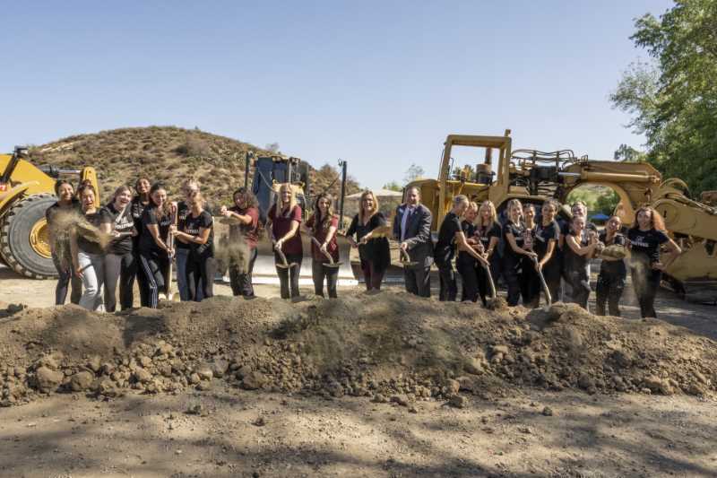 Beach Volleyball Team shovels earth