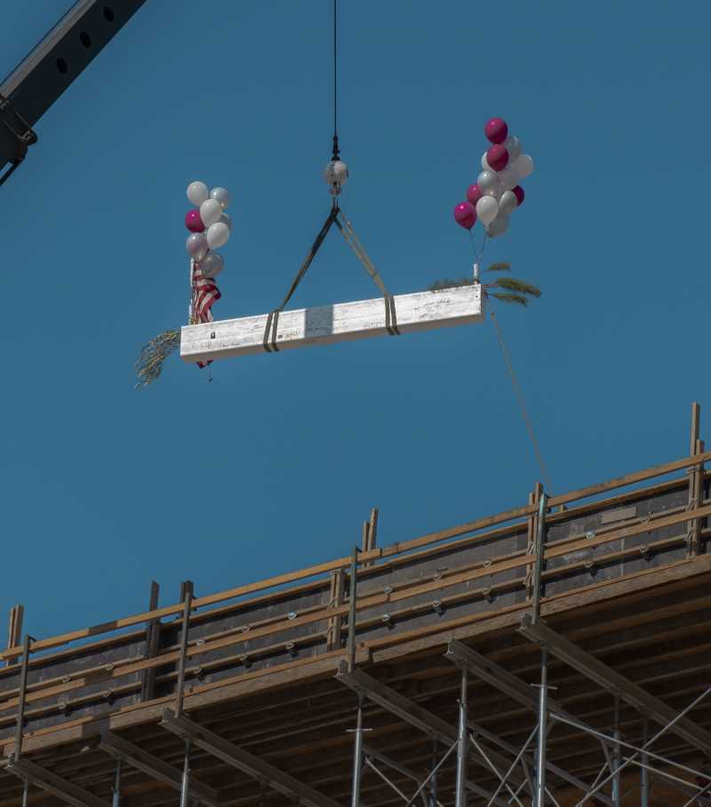 Final beam is lifted onto structure