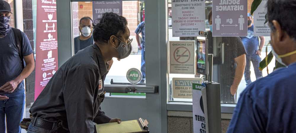 Student uses temperature Check Station