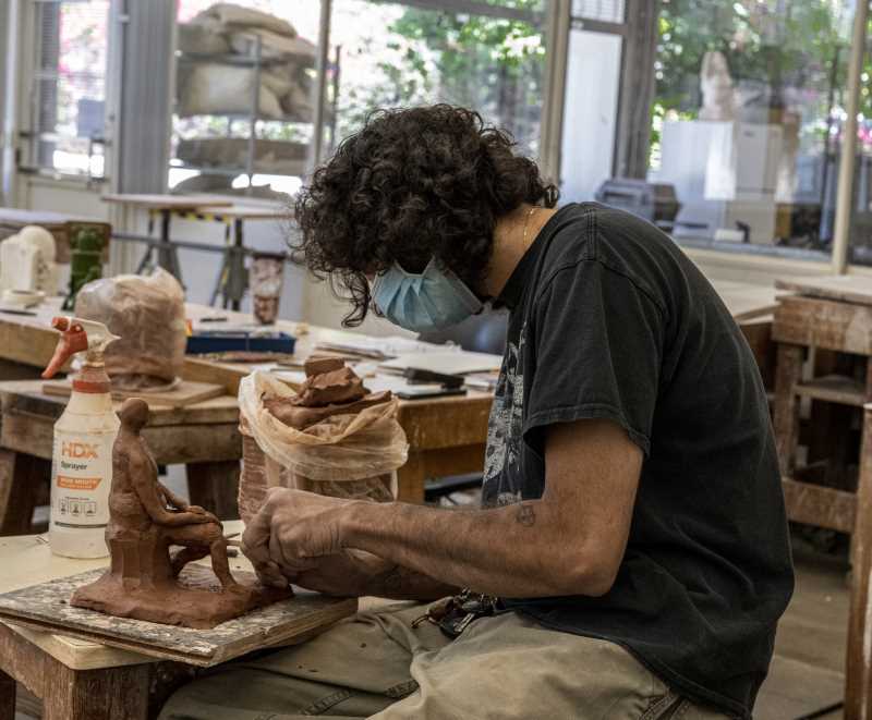 Student works on his sculpture