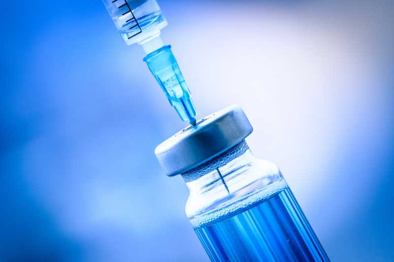 Vaccine being drawn by syringe