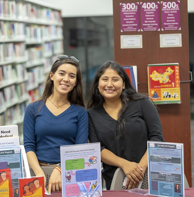 Maria Tejada works an information table for DREAM