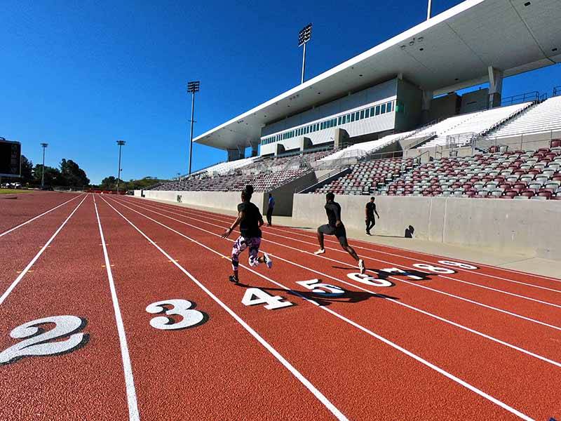 Runners practice at Hilmer Lodge stadium