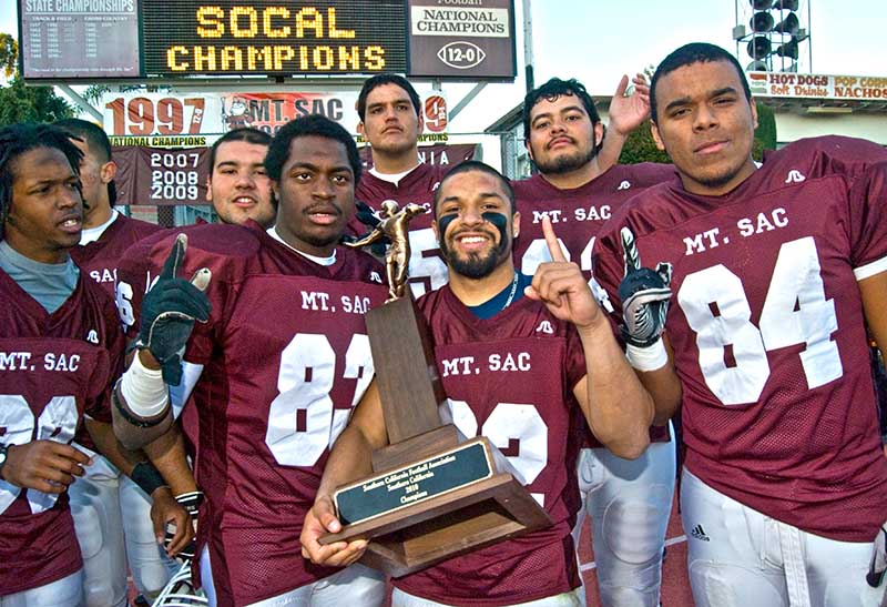 2010 Football Team with championship trophy