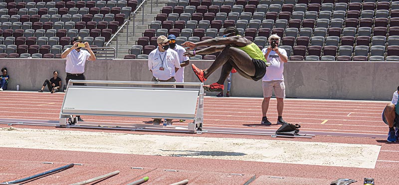 Side view of Omar Craddock in the Triple Jump