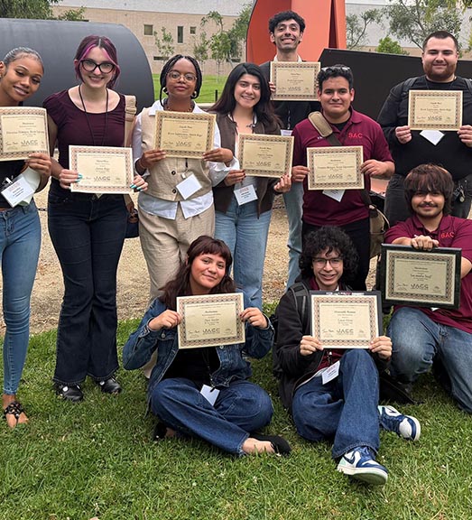 Students holding awards