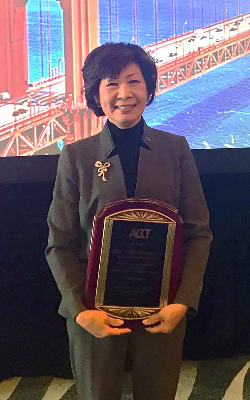 Judy holds ACCT award