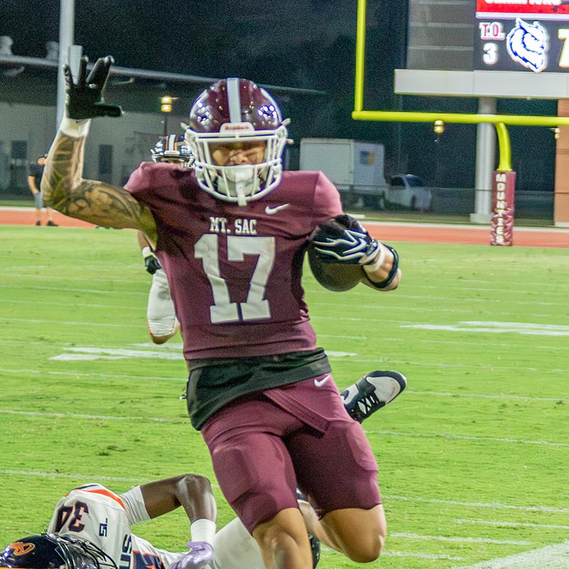 football player runs with the ball