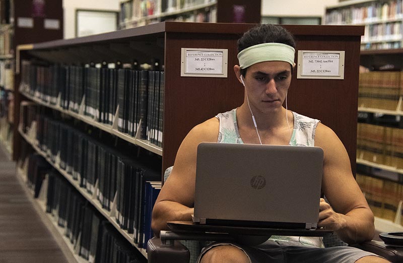 Student on laptop in library