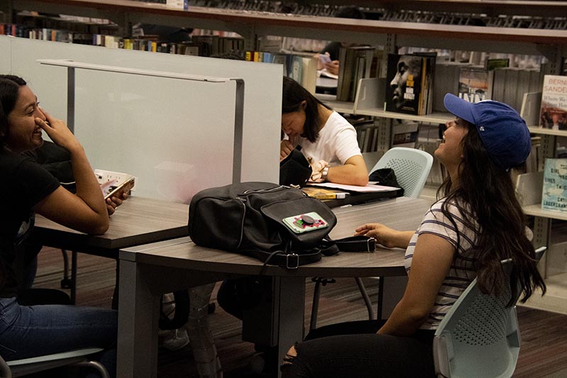 Students socialize in library