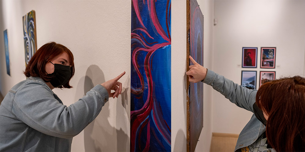 Millerwhite points to the wood of the cabinet that the abstract piece was painted on