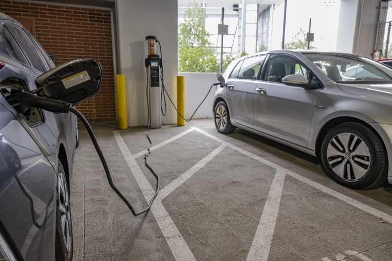 Cars use the EV charging stations in the Gateway Parking Structure