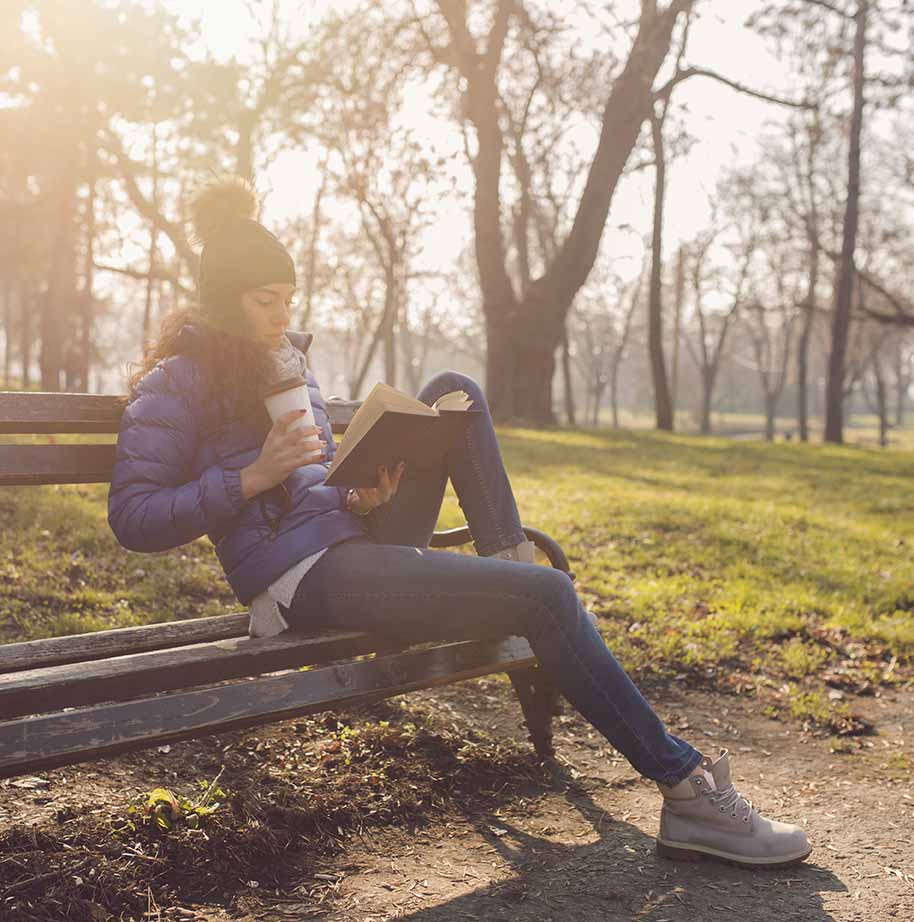 Student on a bench reading