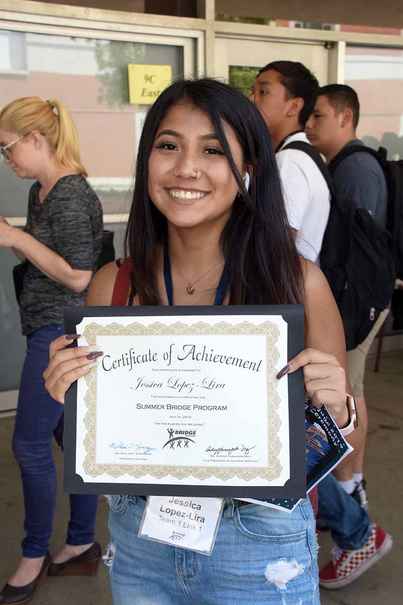 Summer Bridge student with their certificate