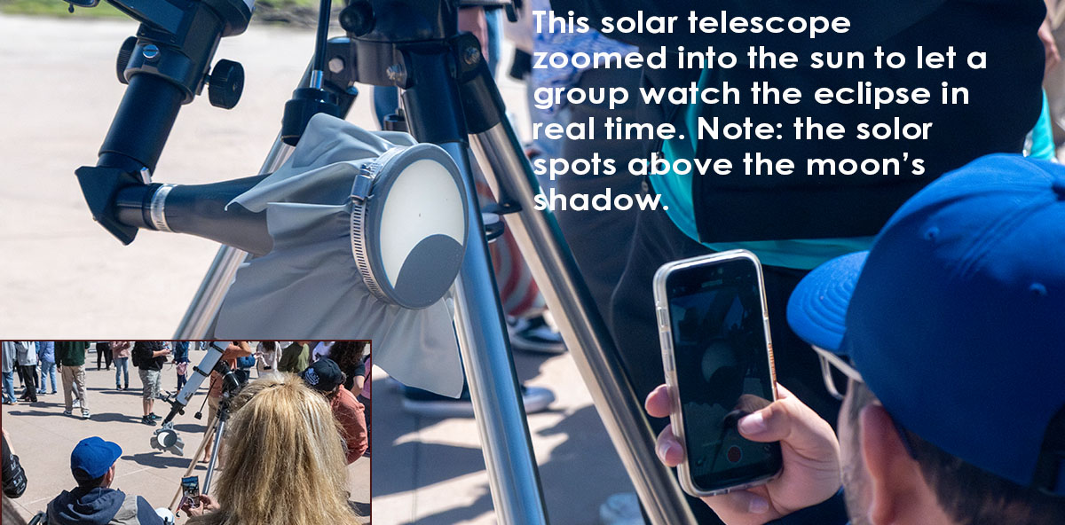 This solar telescope zoomed into the sun to let a group watch the eclipse. Note: the solar spots above the moon's shadow.