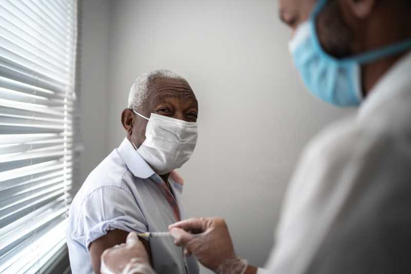 nurse gives vaccine