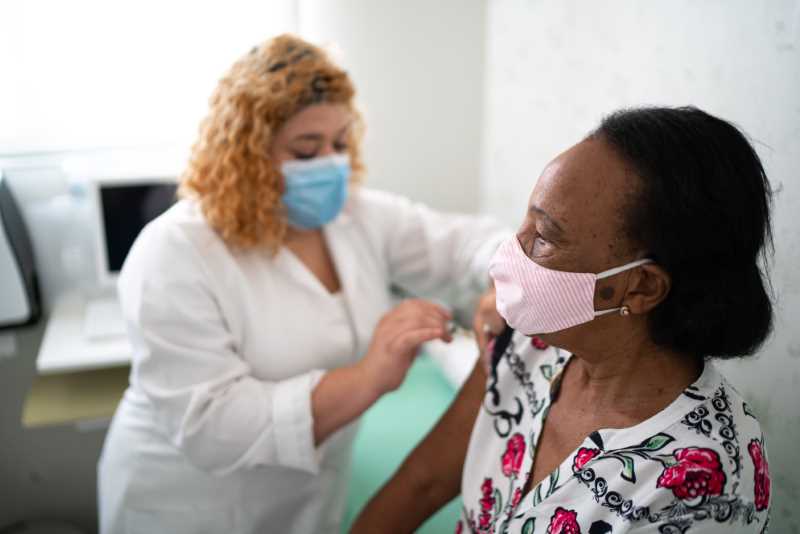 nurse gives vaccine