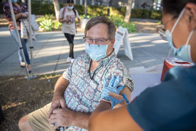 Man gets vaccine from nurse