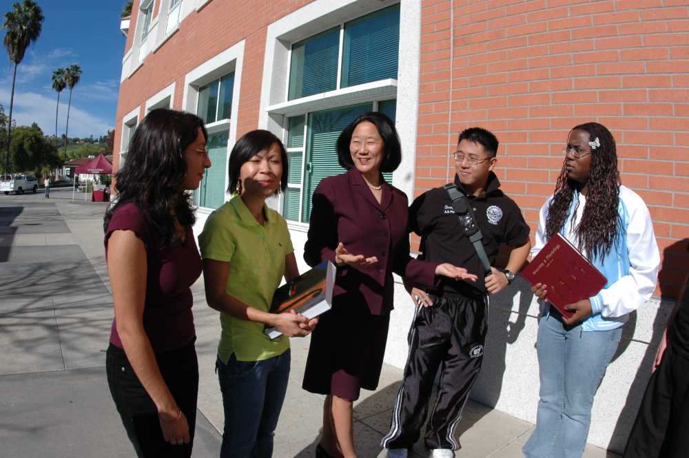 Audrey walks with students circa 2005